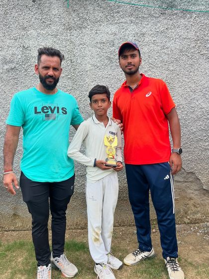 Taresh receiving his Best Bowler trophy for a great spell.