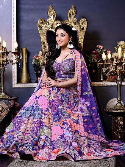 A regal shot of our multi-color printed lehenga with a stylish cape. This indo-western outfit is perfect for someone who wants a modern yet traditional look.