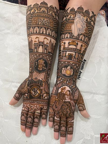 For the couple who loves coffee and photography. This design blends the skylines of Mumbai and Punjab with a Starbucks logo, a camera, and a portrait of the groom as a photographer.