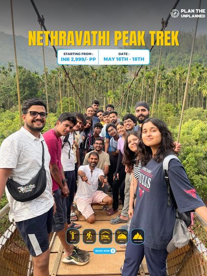 A group poses on a suspension bridge during the Netravathi Peak trek.