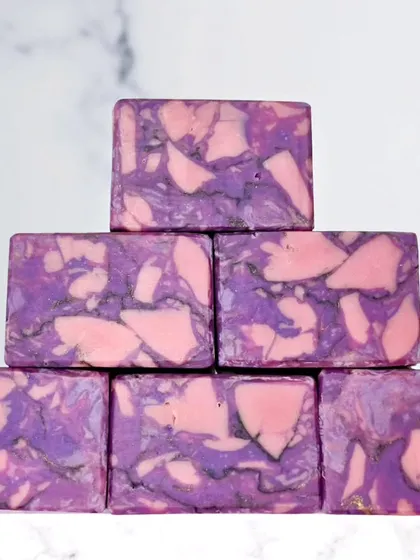A pyramid stack of my Lilac Blooms marbled soap. The combination of pink, purple, and gold shimmer creates a soft, elegant look.