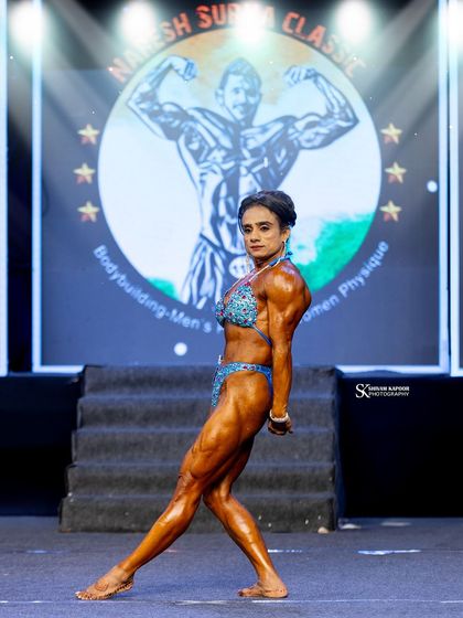 A classic side triceps pose. We ensure every muscle group is developed and displayed perfectly for the judges.