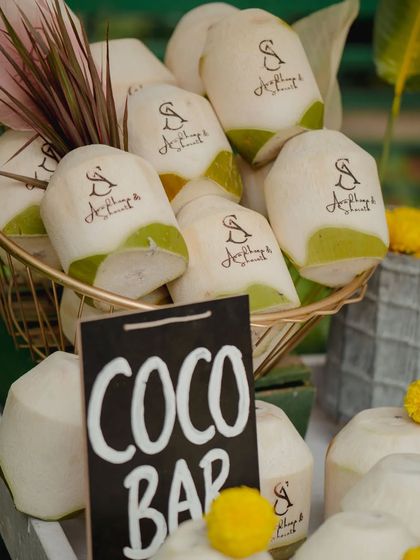 A refreshing and personal welcome for guests. We served coconut water in custom-engraved coconuts featuring the couple's wedding monogram, a detail that was both practical and memorable.
