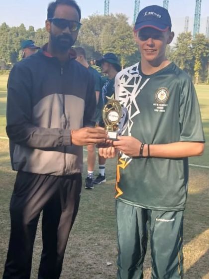 A player from the visiting South African team receives an award from our coach after the match. We encourage a spirit of healthy competition and mutual respect.