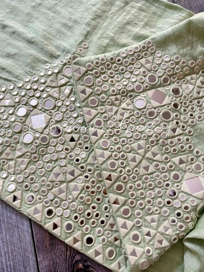 A detail shot of the palazzo's hem, showing the intricate craftsmanship.