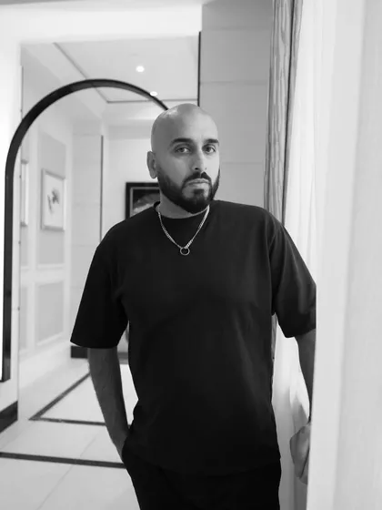 Another black and white portrait, capturing a moment of thought and focus.