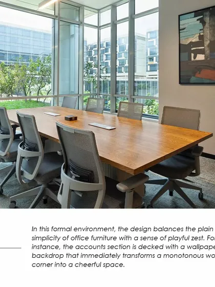 A meeting room at the APT office that balances formal simplicity with playful zest, featuring a vibrant wallpaper backdrop. This detail shows how we inject personality into corporate environments.