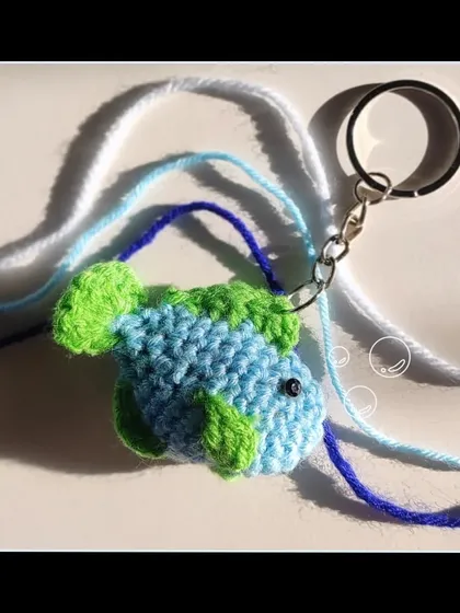 Something's fishy here. This little blue and green crochet fish is a fun and quirky amigurumi keychain.