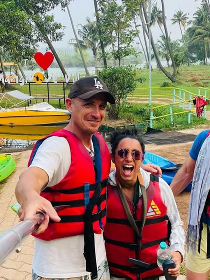 A joyful selfie with friends, all geared up for water sports.