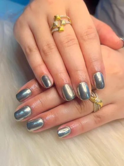A classic silver chrome manicure. This futuristic finish is perfect for parties, events, or anytime you want your nails to be the center of attention.