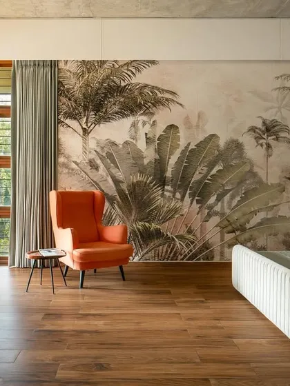 A bedroom should be a private sanctuary connected to the outdoors. In this master bedroom, we used a nature-inspired mural and large windows that open onto a private terrace, blurring the line between the room and the lush landscape outside.