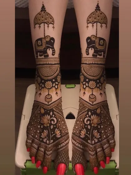 Bridal mehendi isn't just for hands. I create beautiful, detailed designs for feet, like these matching elephants under ceremonial umbrellas, to complete your head-to-toe bridal look.