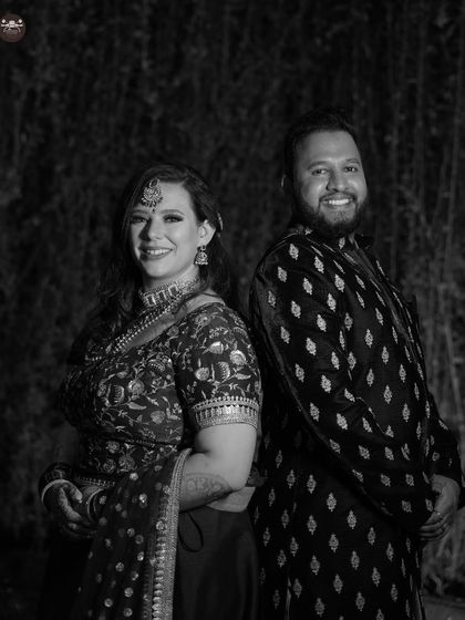 A more formal, yet relaxed, back-to-back pose. Black and white photography helps to create a classic and timeless feel for couple portraits.