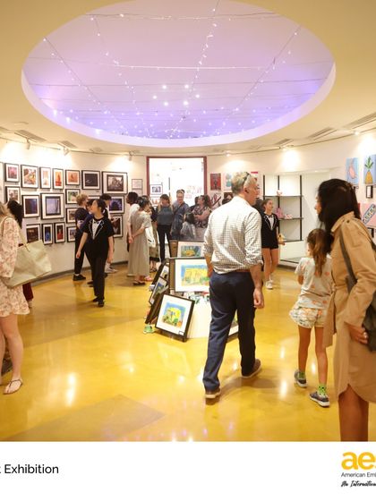 Parents, students, and teachers admire the work at the MS Art Exhibition. These events are a wonderful opportunity for our community to come together and celebrate the artistic achievements of our students.