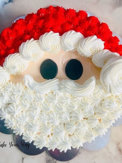 Ho ho ho. A fun pull-apart cupcake cake shaped like Santa's face.