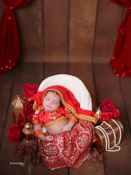 Our little Radha, sleeping peacefully. I have a variety of beautiful, handcrafted traditional outfits and props to create an authentic and respectful cultural photoshoot for your newborn.