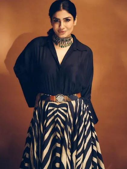 Styling the one and only Raveena Tandon for a photoshoot. I created a textured, slightly messy low ponytail to give a modern edge to her classic black shirt and bold skirt.