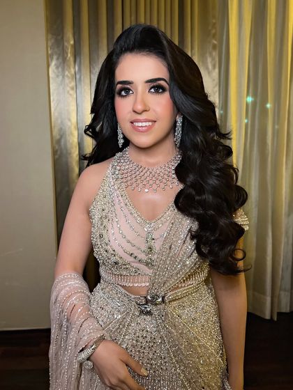 A glamorous cocktail look featuring deep Hollywood waves, perfect for a bride in a sparkling gown.