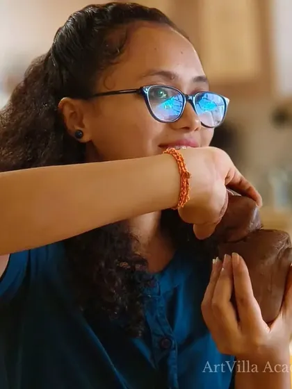 A participant at our Doolally Taproom workshop works on her hand-built piece. These events are a huge hit, filled with great vibes and amazing creativity.