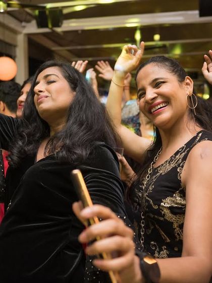 Happy faces and hands in the air at our exclusive Bollywood night.