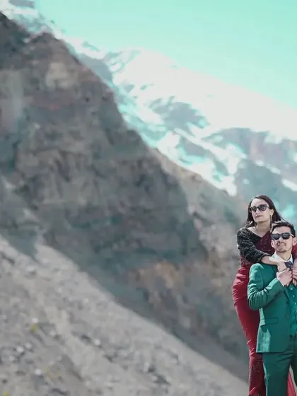 A close-up portrait of the couple with the majestic, snow-capped mountains of Manali in the background. This shot focuses on their connection while still highlighting the epic location.