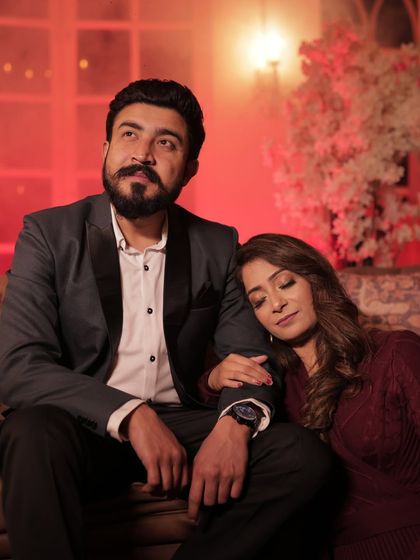 A dramatic and romantic shot from a pre-wedding session. The makeup features a slightly bolder eye to stand out in the warm, low-light setting.