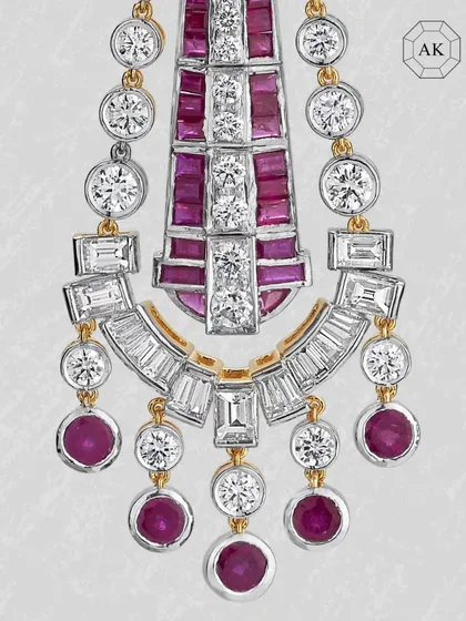 A detailed close-up of the cascading ruby and diamond earrings, showing the precision in every setting.