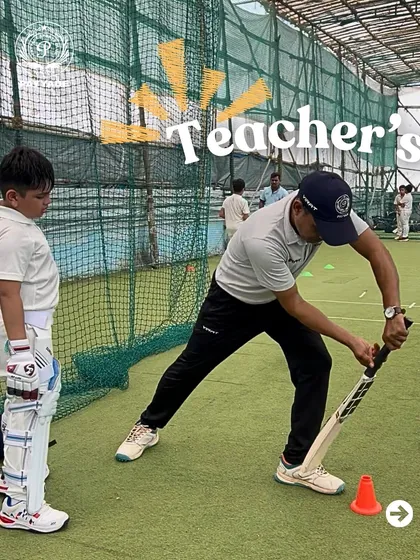 Mastering the art of batting starts with the basics. In this net session, our coach demonstrates the correct body posture and bat swing for a defensive stroke, providing a live example for a young batsman to observe and learn from.