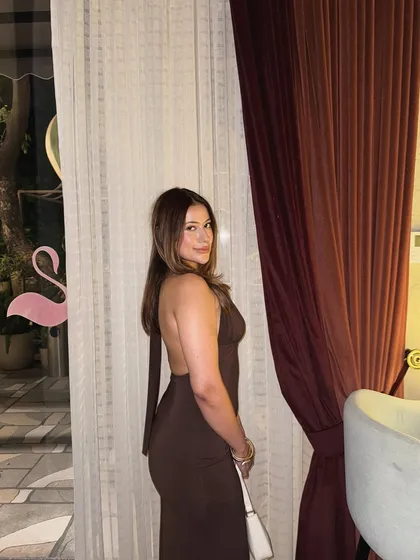 A back view of the brown halter gown, showing its simple yet stunning design.