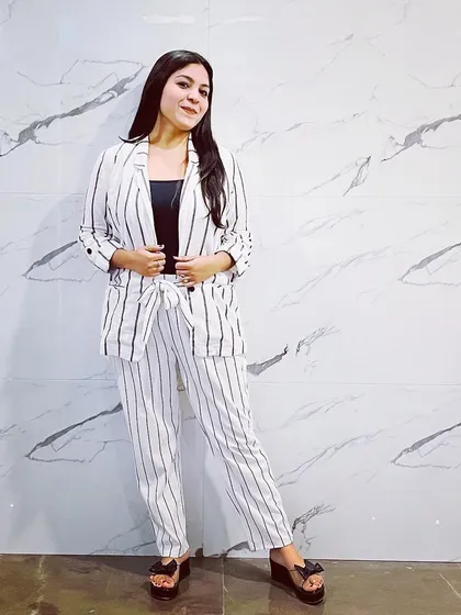 Acing the formal look with this striped co-ord set. A well-fitted blazer and pant set is a power outfit that is a must-have in every working woman's wardrobe.