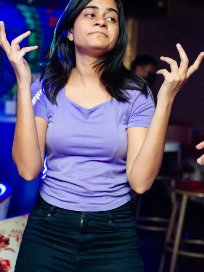 Someone hitting a classic dance move during our 'Beats of Freedom' party. It's all about having fun.