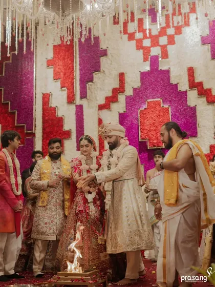 The sacred Agni stands as a witness to the vows. I ensure the mandap design provides a beautiful and respectful setting for the fire rituals, with the couple framed by family and intricate decor.