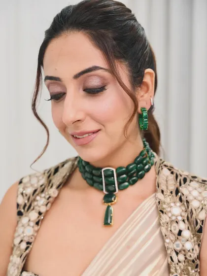 For this shoot with Nykaa, I styled a simple, elegant ponytail with a few soft tendrils to frame the face. The style is clean and allows the focus to be on the makeup and stunning jewelry.