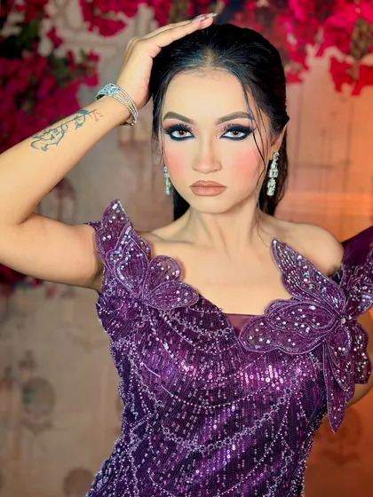 A dramatic and glamorous look for a cocktail party. The focus is on the intense, black smokey eye, paired with a matte nude lip.