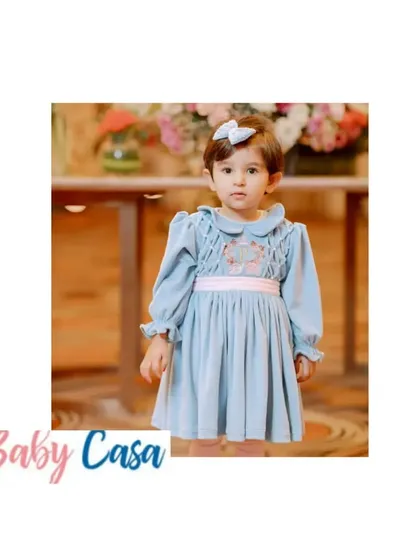 Our velvet collection combines classic style with comfort. This long-sleeved dusty blue dress with delicate embroidery is perfect for keeping your little one warm and stylish during cooler celebrations.