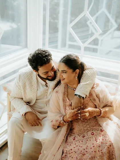 A sweet, candid moment between a couple at their engagement. The natural light and their genuine smiles reflect the warmth and happiness of their relationship.