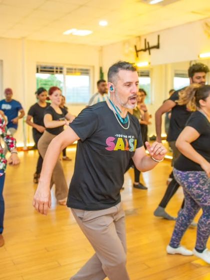 A wide shot of the workshop in progress. You can see a full room of dancers, all focused on learning from Diego and Sofia. The collective energy was amazing.
