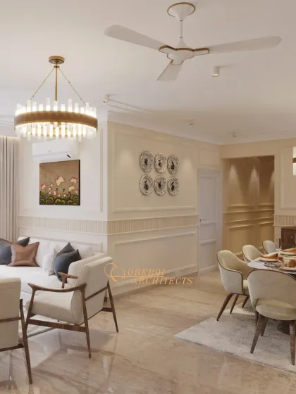 A bright and airy living and dining space with classic wall molding and modern furniture. The design feels fresh, clean, and effortlessly elegant.