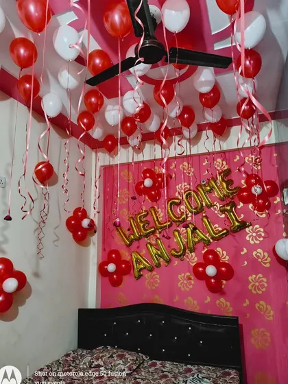 Another angle of the red and white welcome home room decoration.