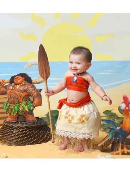The courageous voyager, Moana. This themed outfit, with its layered skirt and signature top, was created for a fun and adventurous first birthday photoshoot.