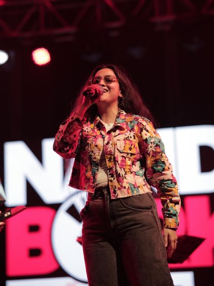 A close-up shot of me singing my heart out in Ahmedabad. Connecting with a live audience and feeling their energy is the best part of being a performer.
