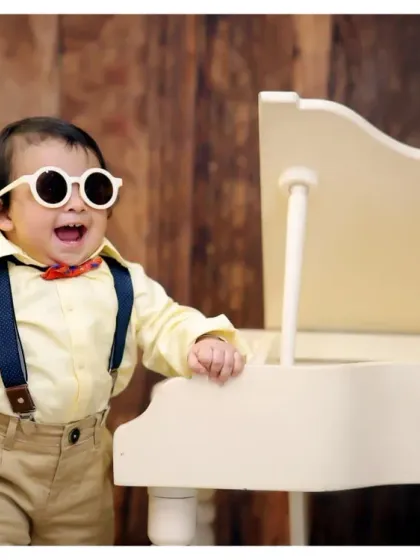 Introducing the little maestro! Our musician-themed shoots, complete with a miniature piano and stylish outfits, are a fantastic way to showcase your child's budding talents and personality.