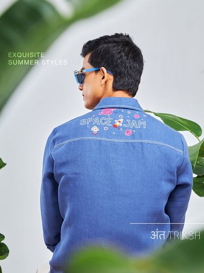 My kind of weekend blues. This denim-look shirt with "Space Jam" embroidery on the back is a playful and stylish piece from the Antriksh collection.