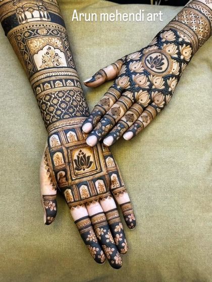 A striking design using negative space to highlight the intricate lotus patterns. The dark-tipped fingers complete this bold look.