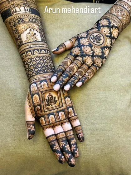 A striking design using negative space to highlight the intricate lotus patterns. The dark-tipped fingers complete this bold look.