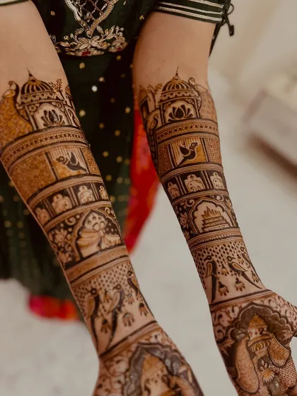 The beauty is in the details. I love creating full, symmetrical bridal designs that tell a story through intricate patterns, like the traditional jharokhas, birds, and sacred kalash motifs shown here.