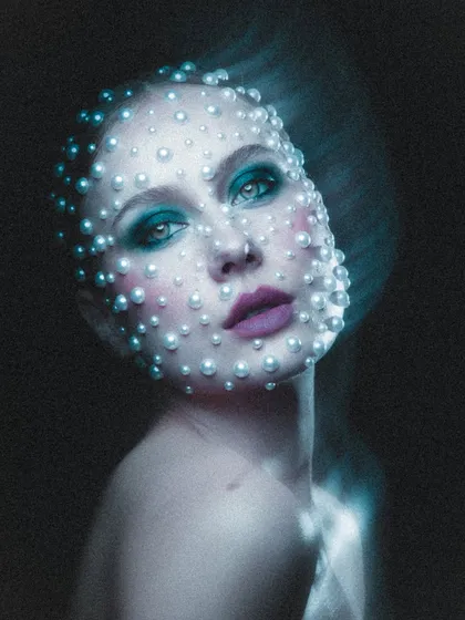 This celestial-inspired look is one of my favorites. We spent hours carefully placing each pearl to create this ethereal, otherworldly effect for a high-concept beauty portrait.