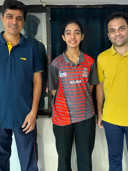 Our player Hrithika Madhur with her coaches after being selected to represent Maharashtra in the U-17 Girls category at the Junior & Youth National Championship.