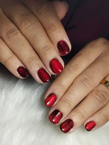 Gloss rhymes with boss. These elegant and classy red cat-eye nails have a deep, dimensional shimmer that is ready to slay.