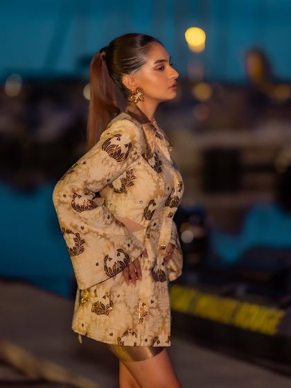 Anushka Sen styled for the Nespresso event at Cannes. This look features a unique printed jacket-dress with cutout details.